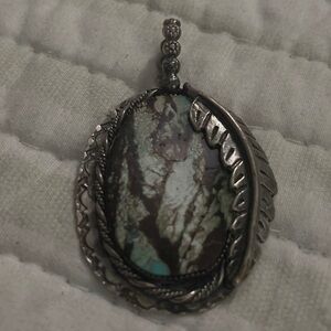 This pendant is beautiful the turquoise is mind blowing made by Jay Chatfield